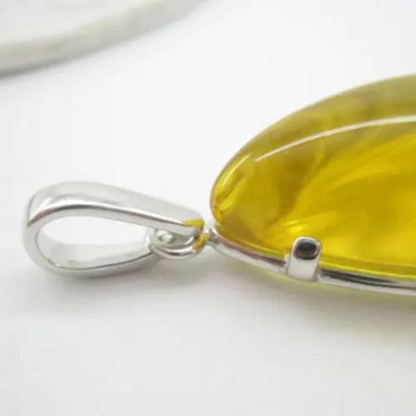 Bursztyn w srebrze rodowanym - wisiorek + rzemień