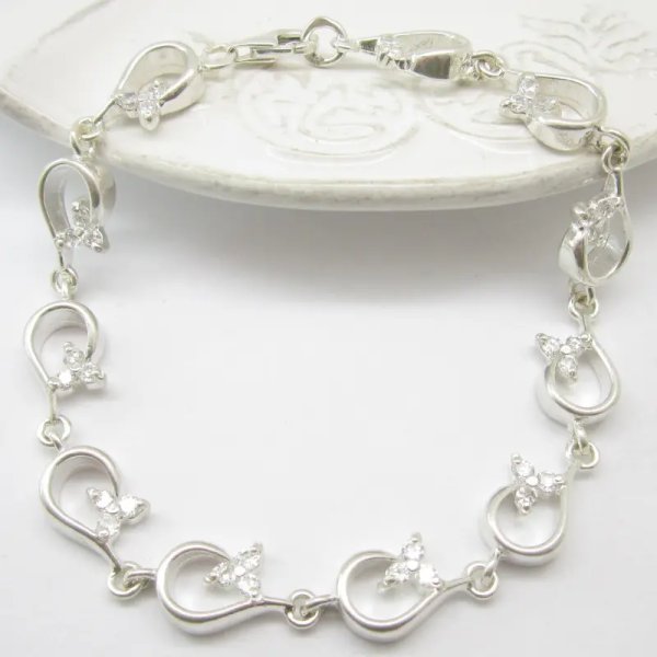 Cyrkonie w srebrze - bransoleta kwiatki