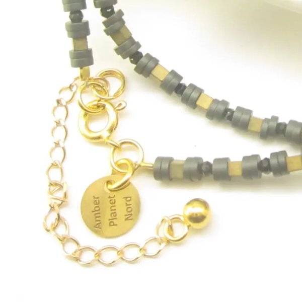 Onyks fasetowany, Hematyt i srebro złocone - naszyjnik typu choker