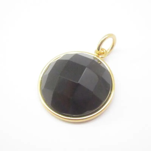 Onyks fasetowany i srebro złocone - zawieszka okrągła