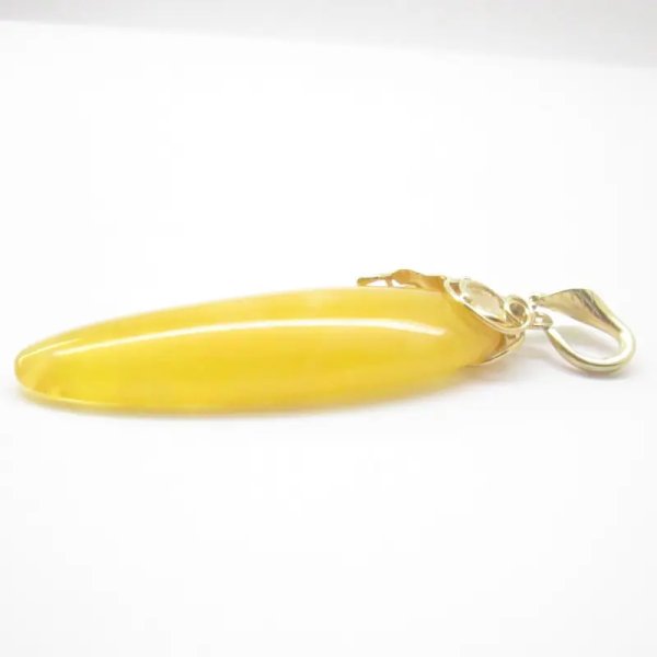 Mleczny Bursztyn i srebro złocone - zawieszka z rzemieniem