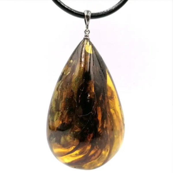 Zawieszka - srebro + bursztyn. Inkluzja roślinna.