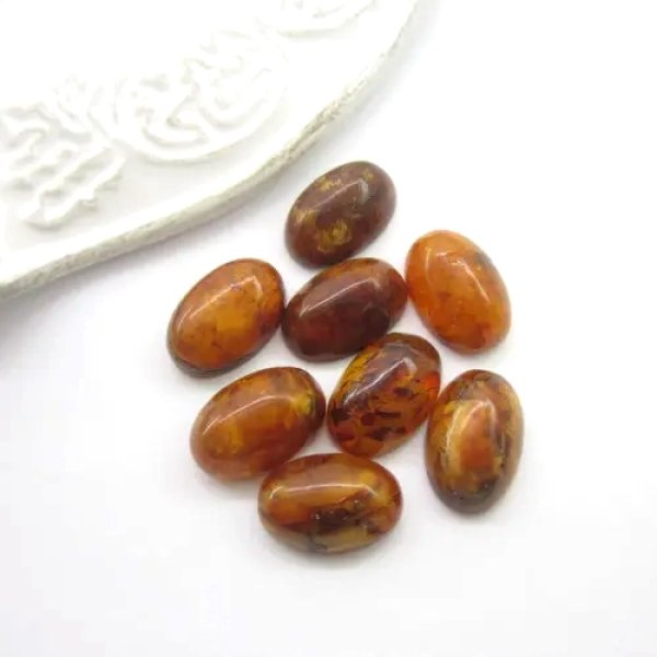 Bursztyn 15x10x6-7mm (8 sztuk) owale