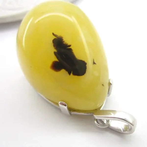 Bursztyn mleczny z pirytem i srebro rodowane - zawieszka łza