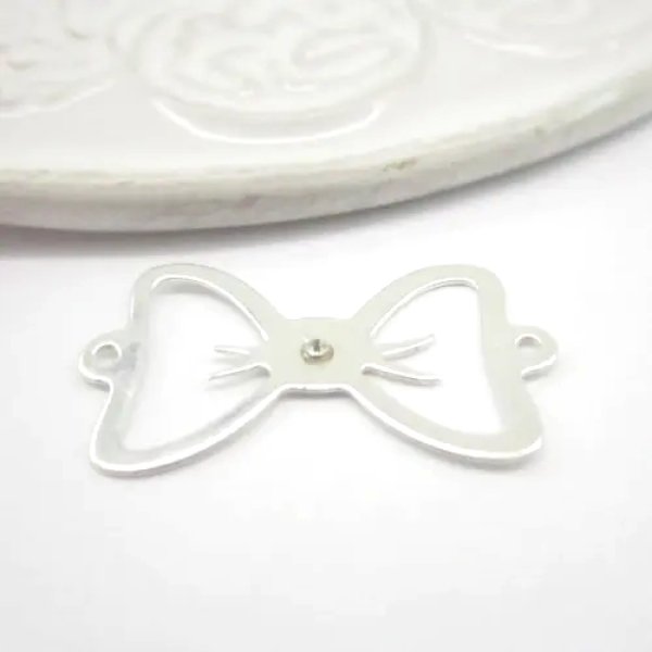 Srebro Ag - element ozdobny kokarda 23x13,5mm z kryształkiem swrovskiego