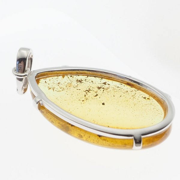 Bursztyn przezroczysty ze szczątkami organicznymi i srebro rodowane - wisiorek łza