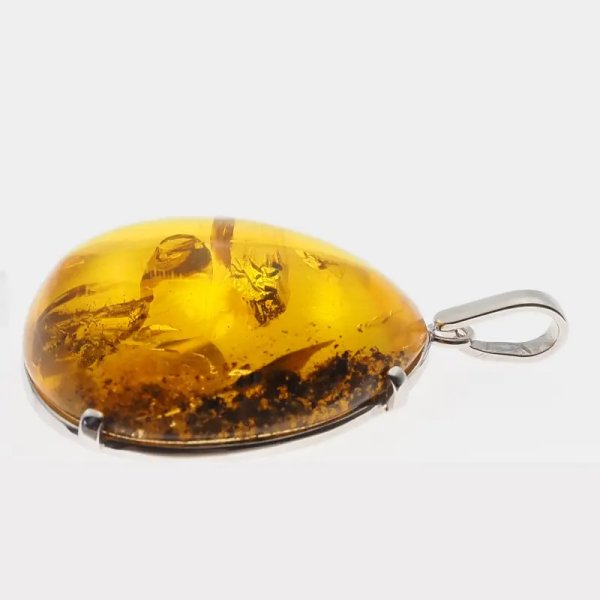 Bursztyn przezroczysty ze szczątkami organicznymi i srebro rodowane - zawieszka łza