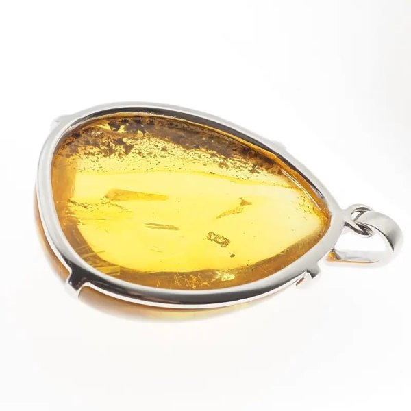 Bursztyn przezroczysty ze szczątkami organicznymi i srebro rodowane - zawieszka łza