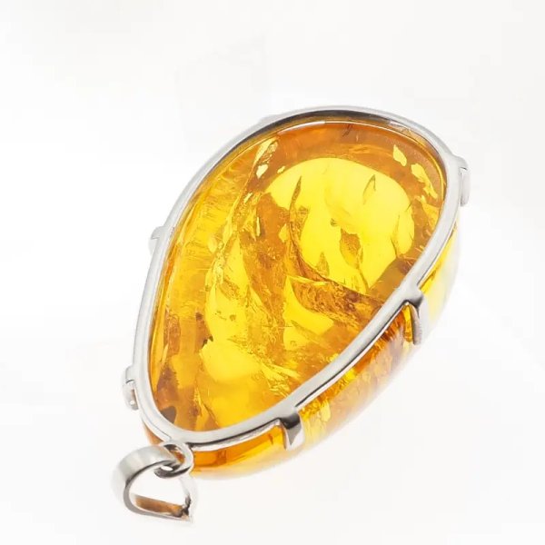 Bursztyn ze szczątkami roślinnymi i srebro rodowane - duża zawieszka