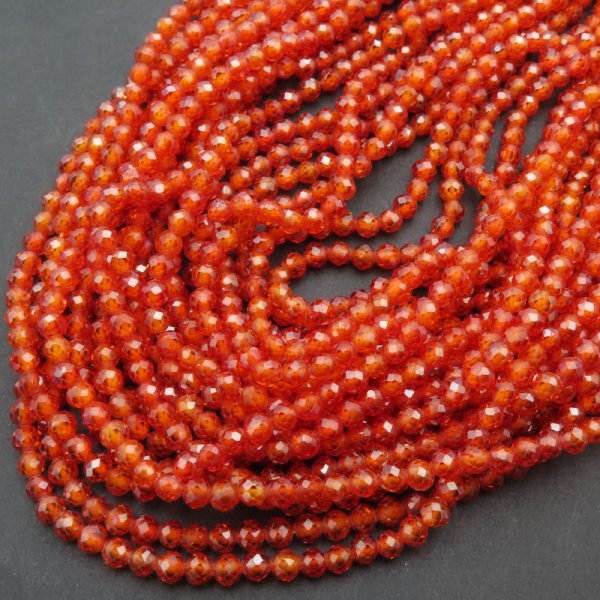 Cyrkon syntetyczny pomarańczowy fasetowane kulki 3 mm – sznur ok. 38 cm