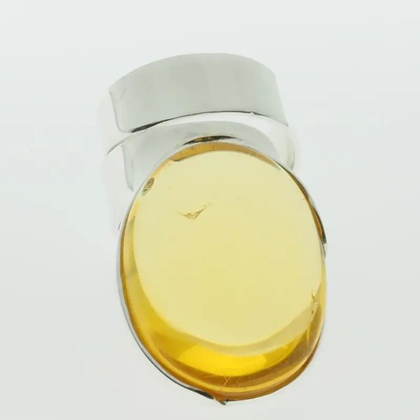 Przezroczysty Bursztyn owalny i srebro - pierścionek regulowany (Rozmiar Jubilerski 17)