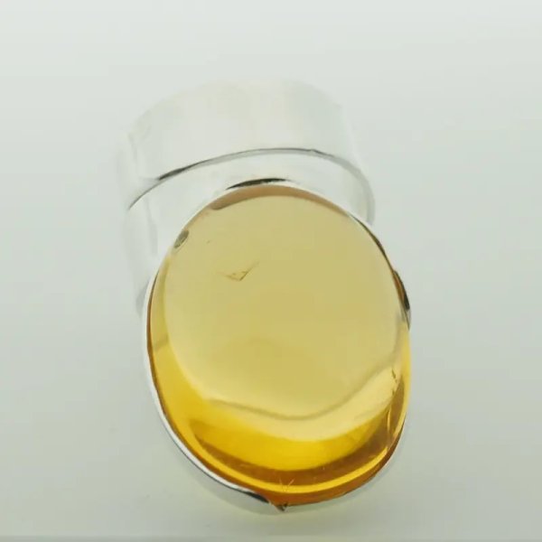 Przezroczysty Bursztyn owalny i srebro - pierścionek regulowany (Rozmiar Jubilerski 17)