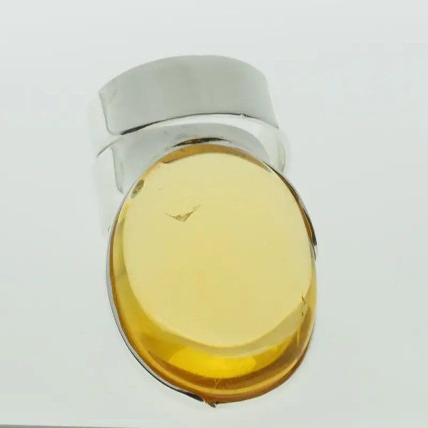 Przezroczysty Bursztyn owalny i srebro - pierścionek regulowany (Rozmiar Jubilerski 17)