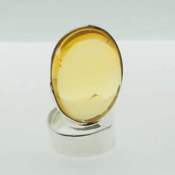 Przezroczysty Bursztyn owalny i srebro - pierścionek regulowany (Rozmiar Jubilerski 17)