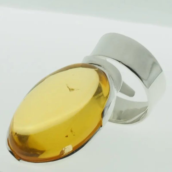 Przezroczysty Bursztyn owalny i srebro - pierścionek regulowany (Rozmiar Jubilerski 17)