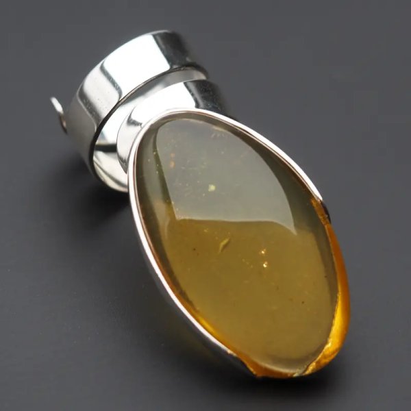 Przezroczysty Bursztyn owalny i srebro - pierścionek regulowany (Rozmiar Jubilerski 15)