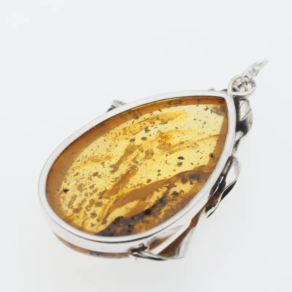 Przezroczysty bursztyn z szczątkami organicznymi  i srebro oksydowane - wisiorek