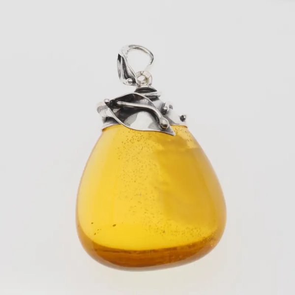Przezroczysty bursztyn z chmurami i pęcherzykami powietrza i srebro oksydowane - zawieszka