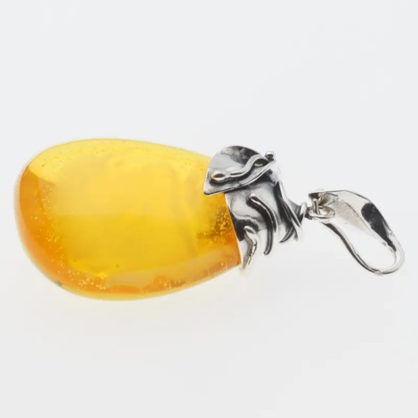 Przezroczysty bursztyn z chmurami i pęcherzykami powietrza i srebro oksydowane - zawieszka