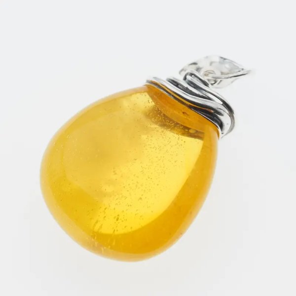 Przezroczysty bursztyn z chmurami i pęcherzykami powietrza i srebro oksydowane - zawieszka