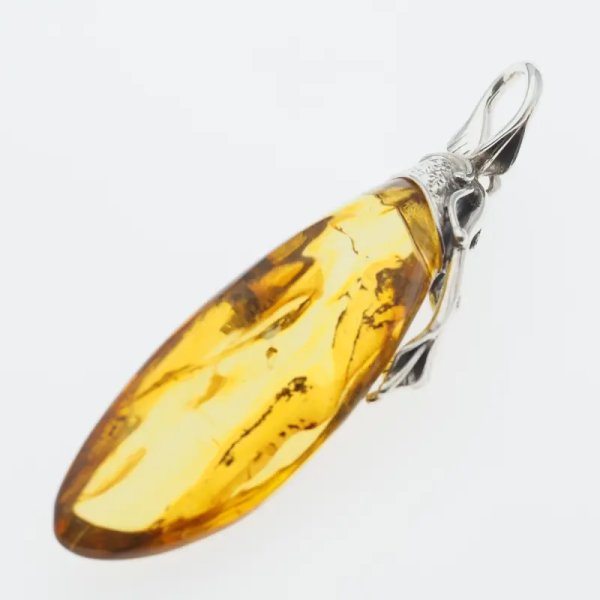 Przezroczysty bursztyn z szczątkami organicznymi  i srebro oksydowane - zawieszka