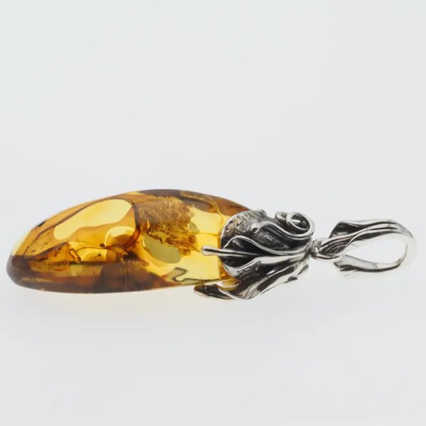 Przezroczysty bursztyn z szczątkami roślinnymi  i srebro oksydowane - zawieszka