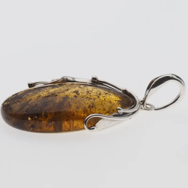 Przezroczysty bursztyn z szczątkami organicznymi  i srebro oksydowane - wisiorek
