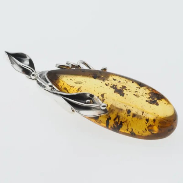 Przezroczysty bursztyn z szczątkami organicznymi  i srebro oksydowane - wisiorek