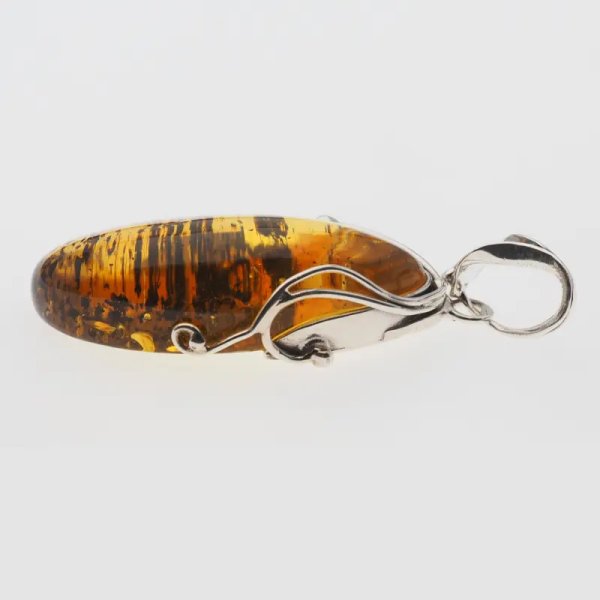 Przezroczysty bursztyn z szczątkami organicznymi  i srebro oksydowane - wisiorek