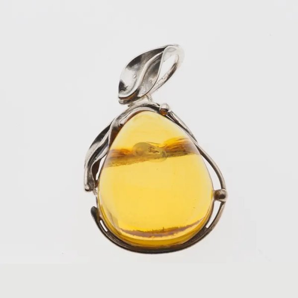 Przezroczysty bursztyn z szczątkami roślinnymi  i srebro oksydowane - wisiorek