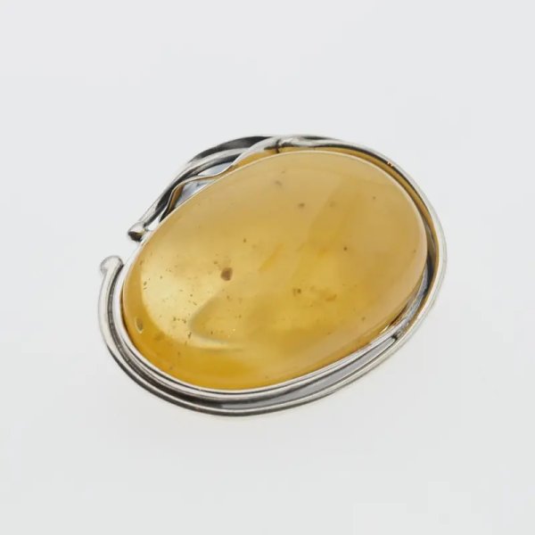 Mleczno-przezroczysty bursztyn i srebro oksydowane - broszka