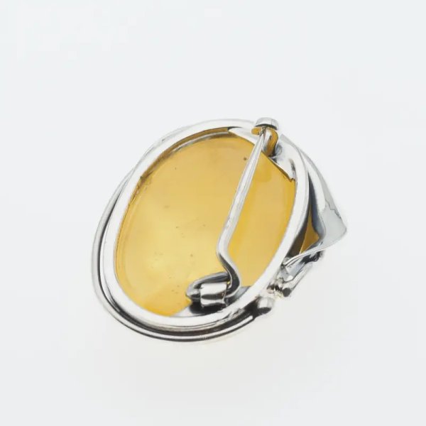 Mleczno-przezroczysty bursztyn i srebro oksydowane - broszka