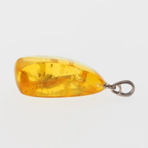 Bursztyn przezroczysty, szczątki organiczne i srebro oksydowane - zawieszka łza