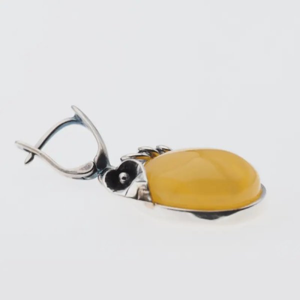 Bursztyn mleczny w srebrze oksydowanym - kolczyki owalne z liśćmi