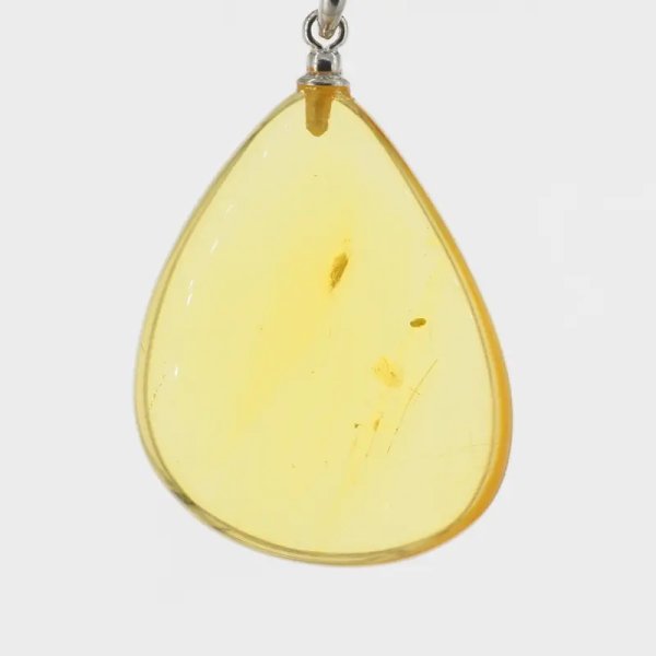 Transparentny bursztyn i srebro - naszyjnik na rzemieniu