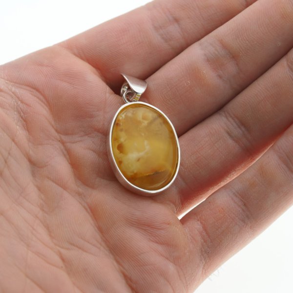 Bursztyn mleczno-przezroczysty i srebro - zawieszka owal