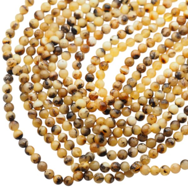 Bursztyn mleczny polerowany kulka 6 mm (sznur 39 cm)