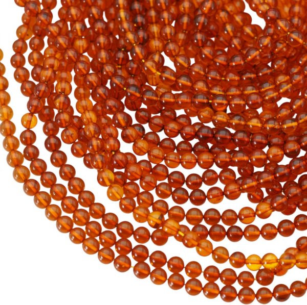 Bursztyn koniakowy kulka 5,7mm (sznur)