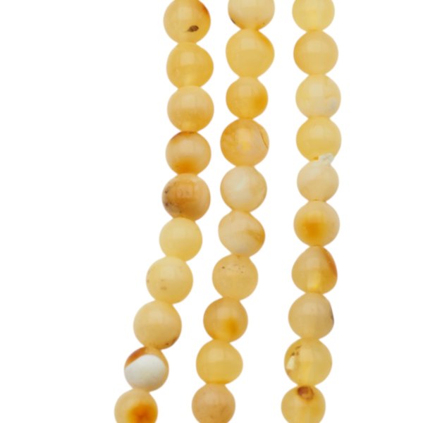 Bursztyn mleczny polerowany kulka 3,5,-4 mm (sznur 40 cm)