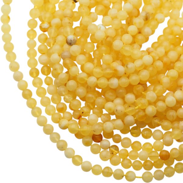 Bursztyn mleczny polerowany kulka 5,2-5,4 mm (sznur 40 cm)
