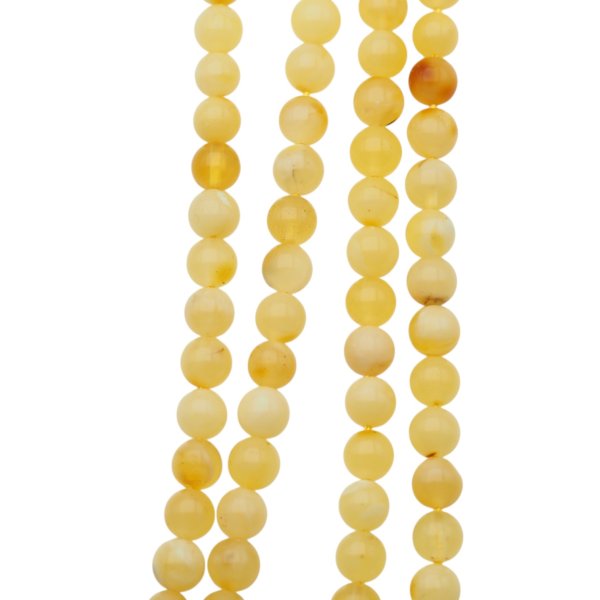 Bursztyn mleczny polerowany kulka 5-5,2 mm (sznur 39 cm)