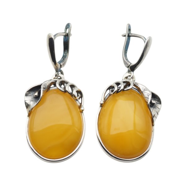 Bursztyn mleczny w srebrze oksydowanym - kolczyki owalne z liśćmi