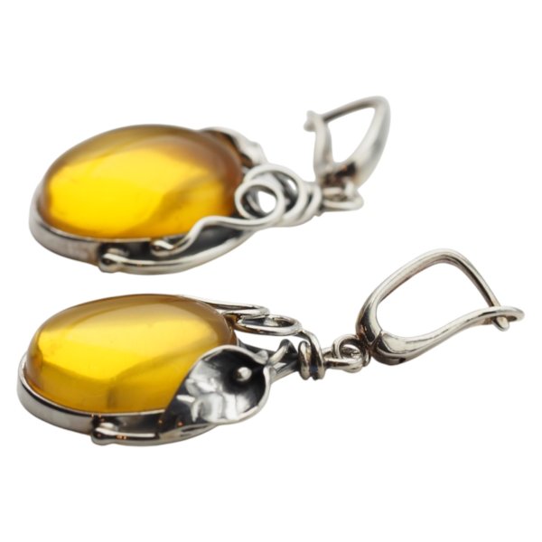 Bursztyn transparentny ze szczątkami organicznymi w srebrze oksydowanym - kolczyki owal z liśćmi