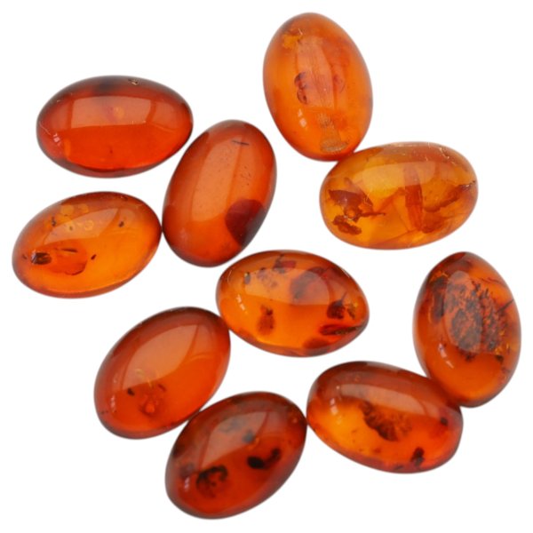 Bursztyn koniakowy kaboszony owalne 15x10 mm – pakiet 10 szt.