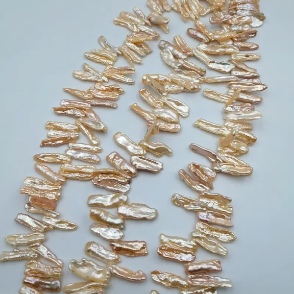 Perły Naturalne Hodowane łososiowe patyczki <br>16-25x6 mm (sznur)